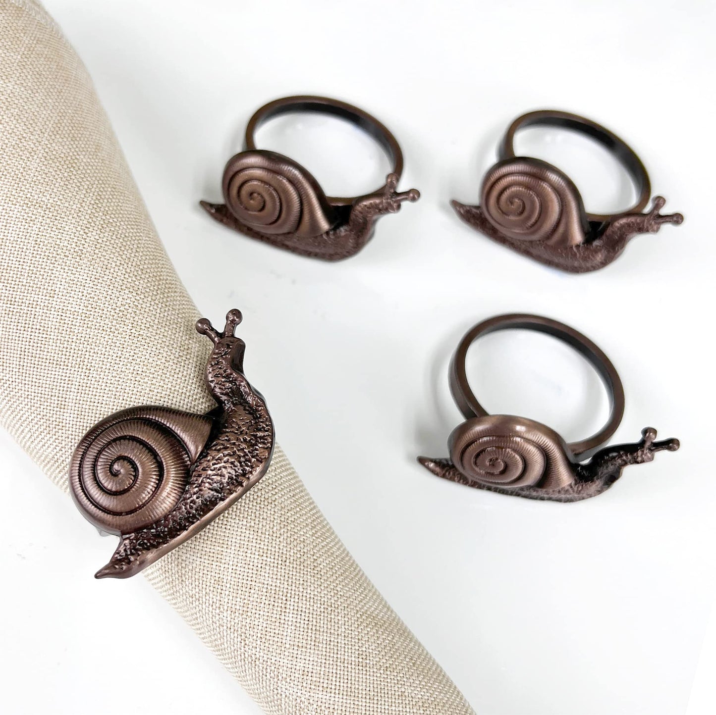 Fennco Styles Nature's Touch Snail Metal Napkin Rings, Set of 4 – Copper Napkin Holders for Family Dinner, Themed Party, Table Décor, Banquets, Holidays and Special Occasion