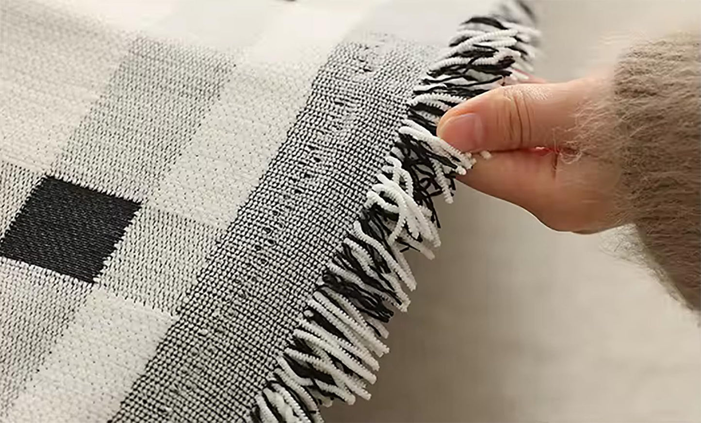 Fennco Styles Checkered Fringe Chenille Reversible Throw Blanket 50" W x 72" L - Black and White Plaid Woven Soft Blanket for Bed, Couch, Sofa, Home, Office and Holidays Décor